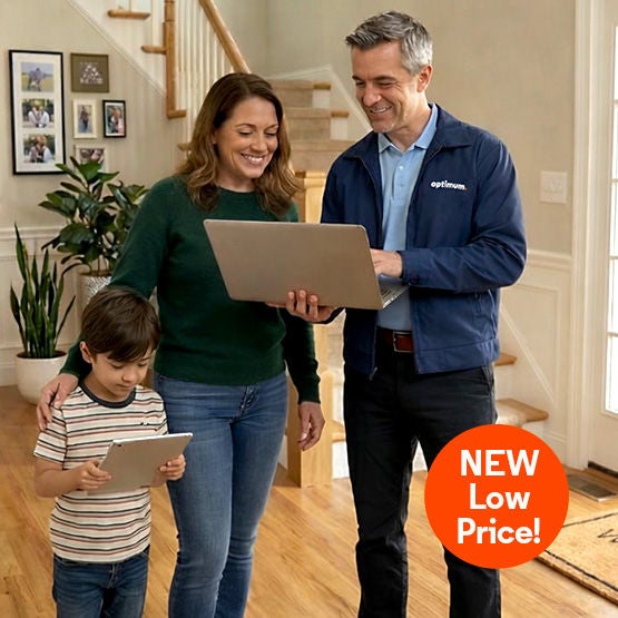 Parent, child, and Optimum technician in living room all connected to Optimum Whole Home WiFi with full signal 