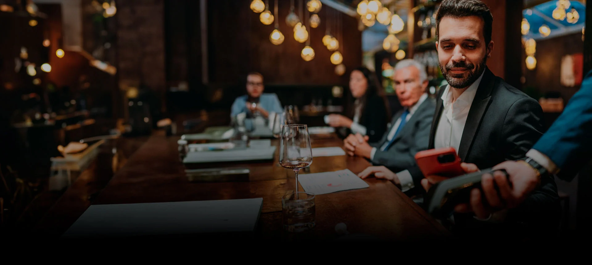 Two men discussing business at a restaurant.