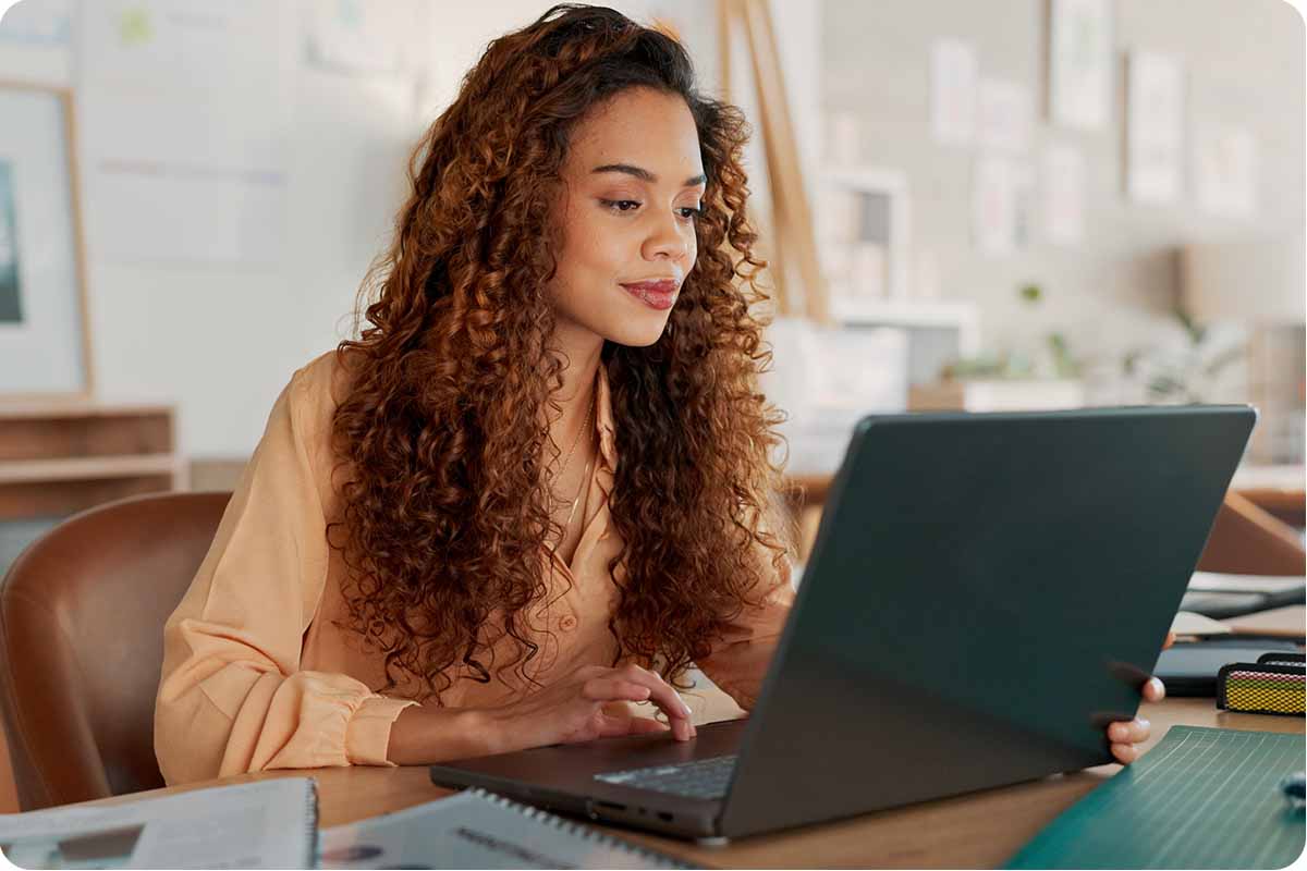 Young Lady searching the Internet on her laptop