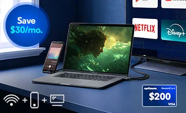 Laptop showing a green game beside a phone on a dark desk; Netflix and Disney+ logos and $200 Visa card 