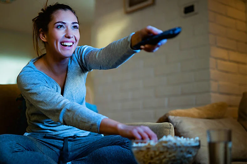 Woman Binge Watching on a Streaming Platform