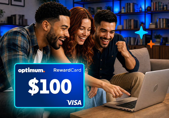 Three people smiling around a laptop next to a $100 Optimum Visa Reward Card.
