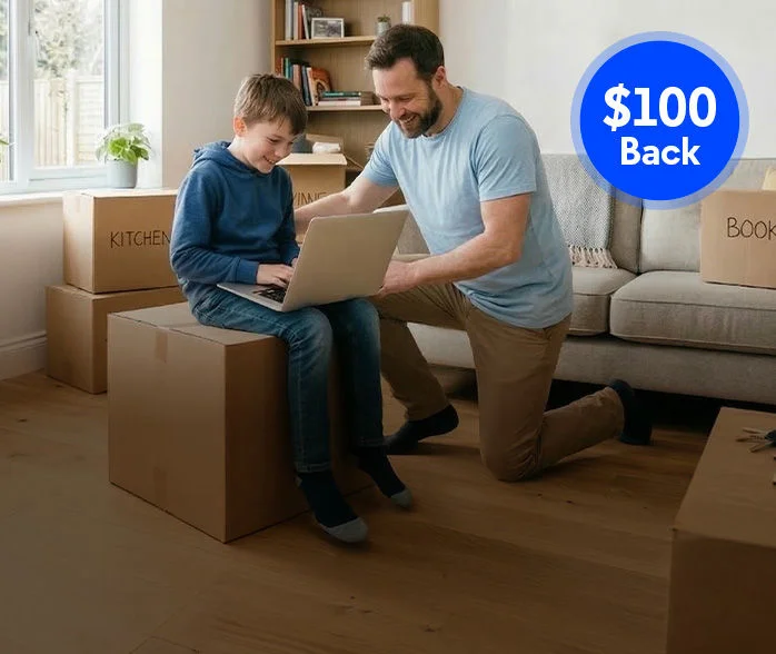 Parent and child with moving boxes keeping Optimum Fiber Internet service at new home