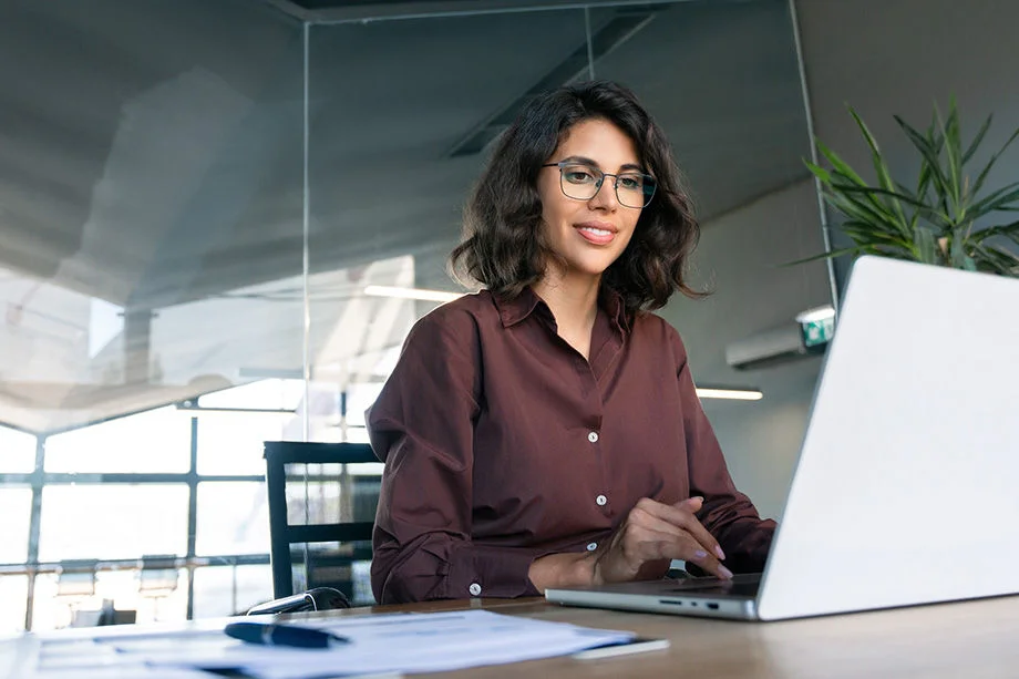 Businesswoman working w/ Dedicated Internet Connection