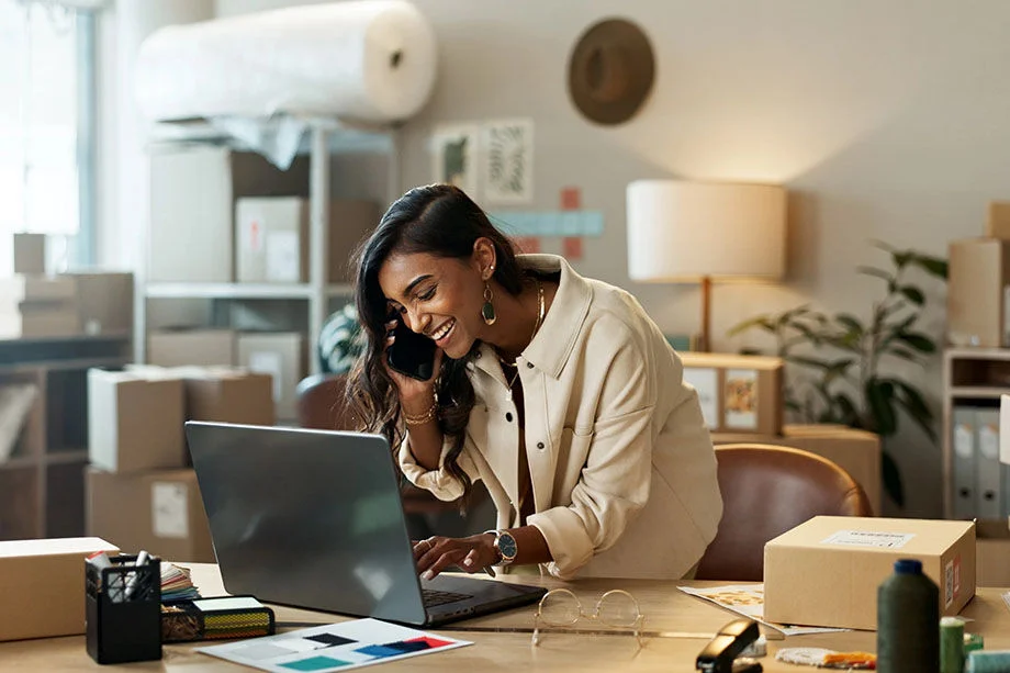 Woman working on laptop.