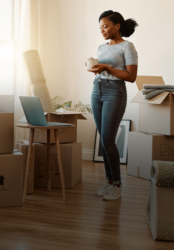 Woman on tablet in new home setting up Optimum Fiber Internet for the first time