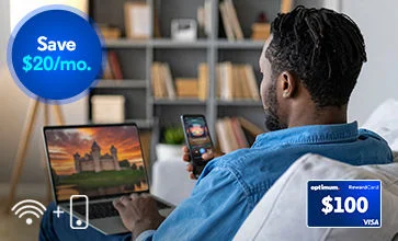 Man in denim seen from behind looks at a laptop and phone in a study; WiFi-plus-phone icon and $100 Visa card 