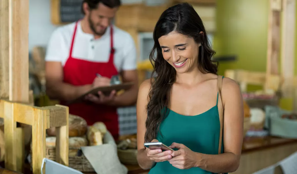 Customer interacting with PRO WiFi at a small business