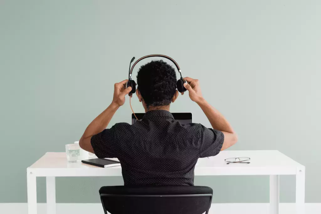 Remote worker putting on a headset