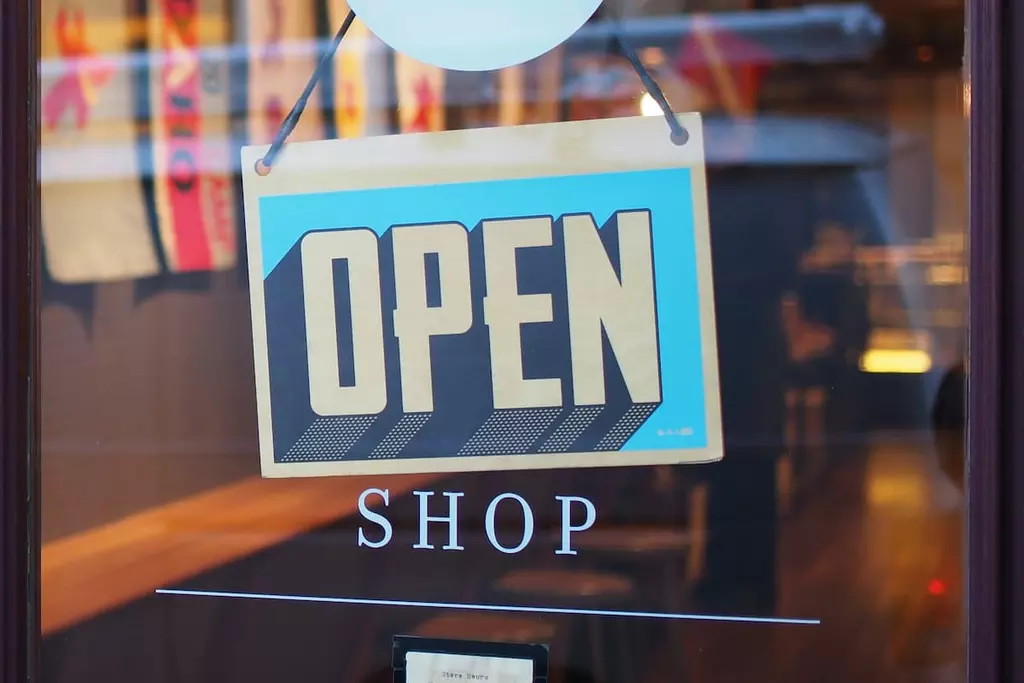 Front door of a store with an open sign