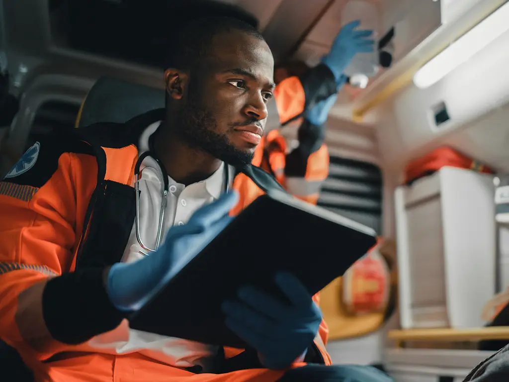 Healthcare Internet Technician reviewing Patient Journey w/ Optimum Business