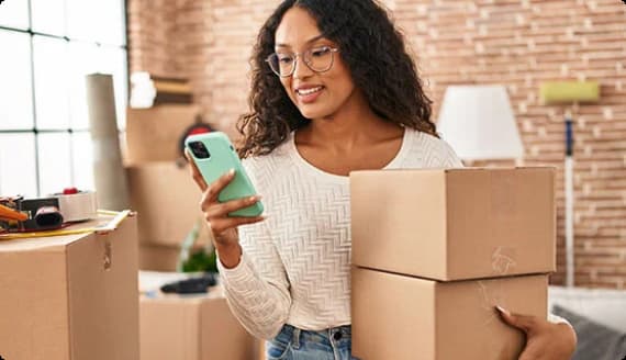 Person carrying moving boxes