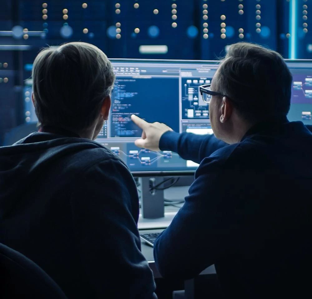 managed-ddos-body-2guys-on-computer.jpg
