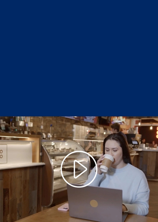a person in a cafe on their laptop