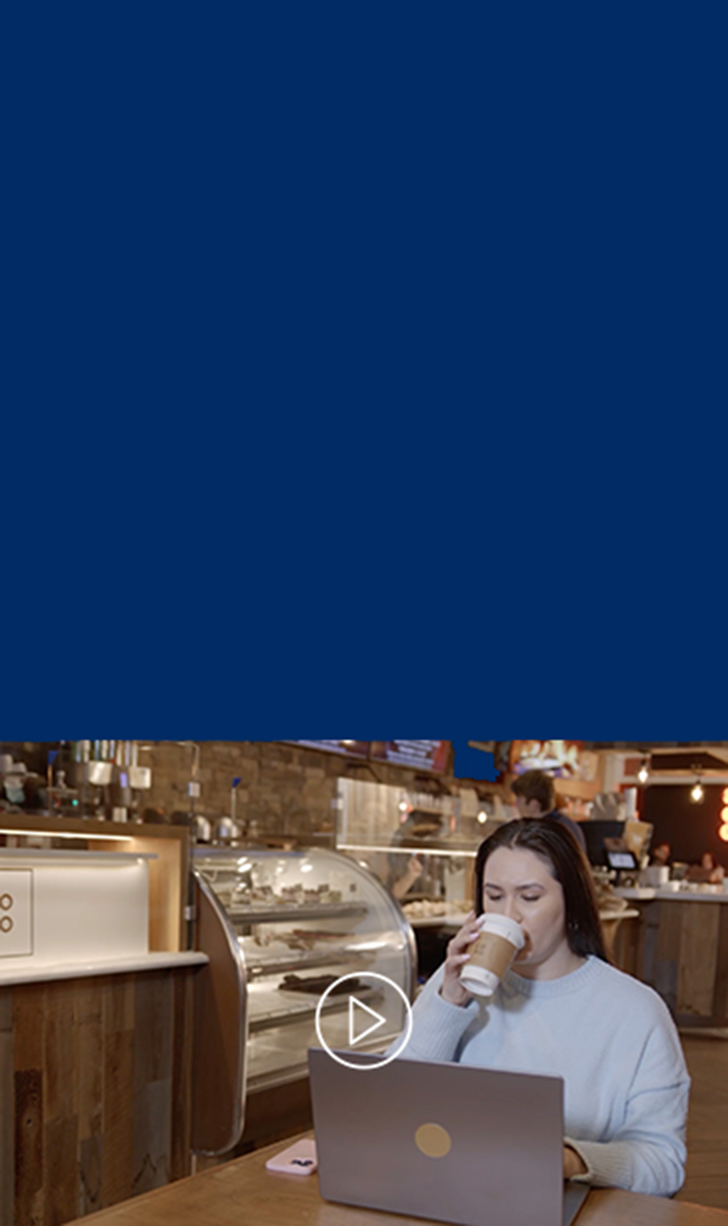 a person in a cafe on their laptop