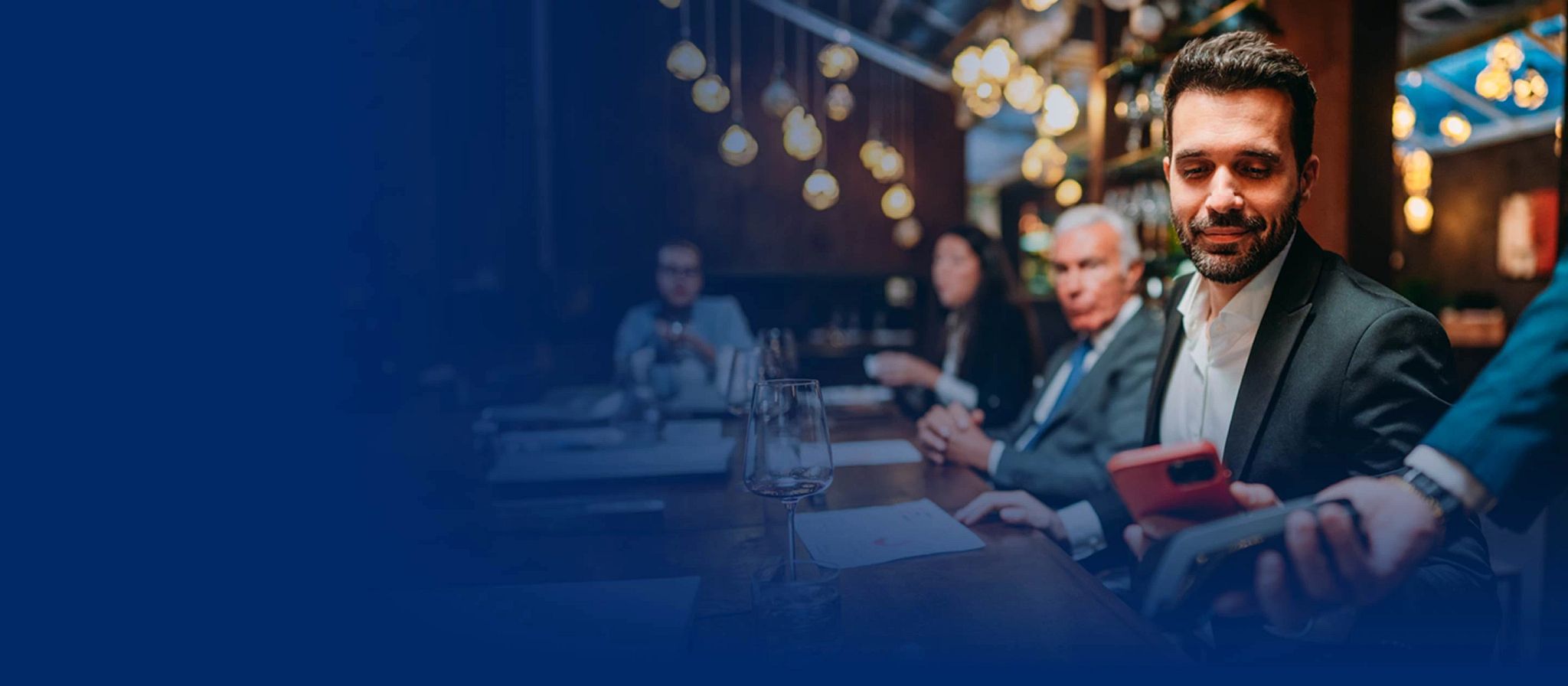Two men discussing business at a restaurant.