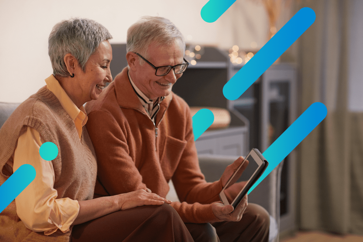 older couple using video chat on a tablet with Optimum blue stripe background 